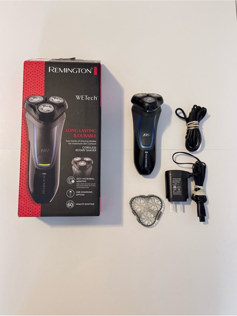 Remington Black Shaver with Blue Trim and Silver Heads